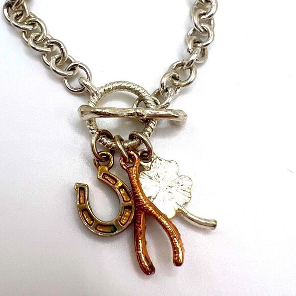 *3/$20* Silver tone toggle bracelet with horseshoe clover and wishbone charms - Picture 3 of 3